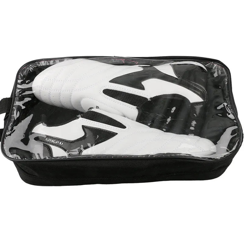 Black and white children's martial arts training shoes with a soft sole and widened design.