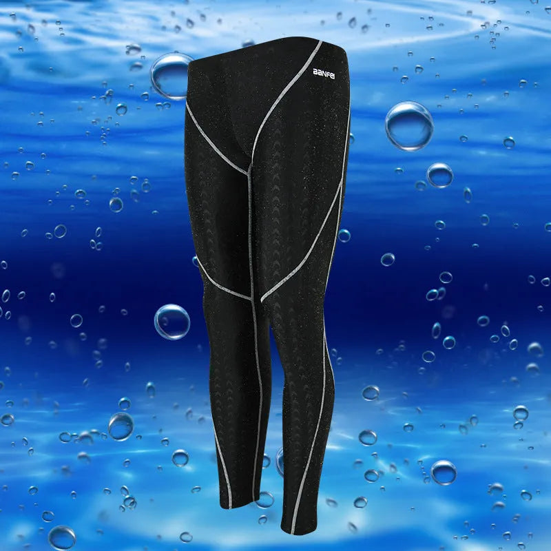 Men's black cropped nylon swimming trunks with mesh lining, shown on size chart