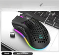 Hollow-out wireless gaming mouse with luminous charging feature in cyan colour.