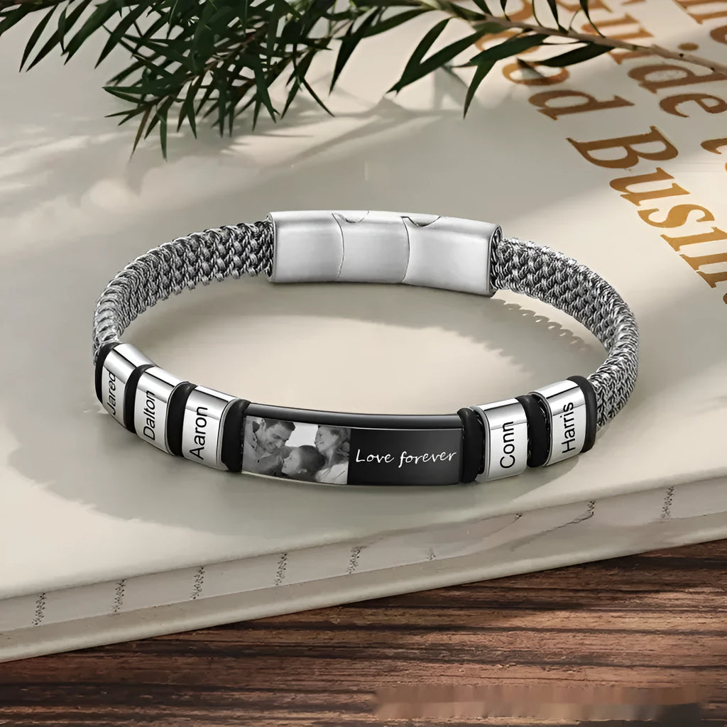 Men's titanium steel bracelet with leather rope band and heart-shaped lettering beads in a gift box.