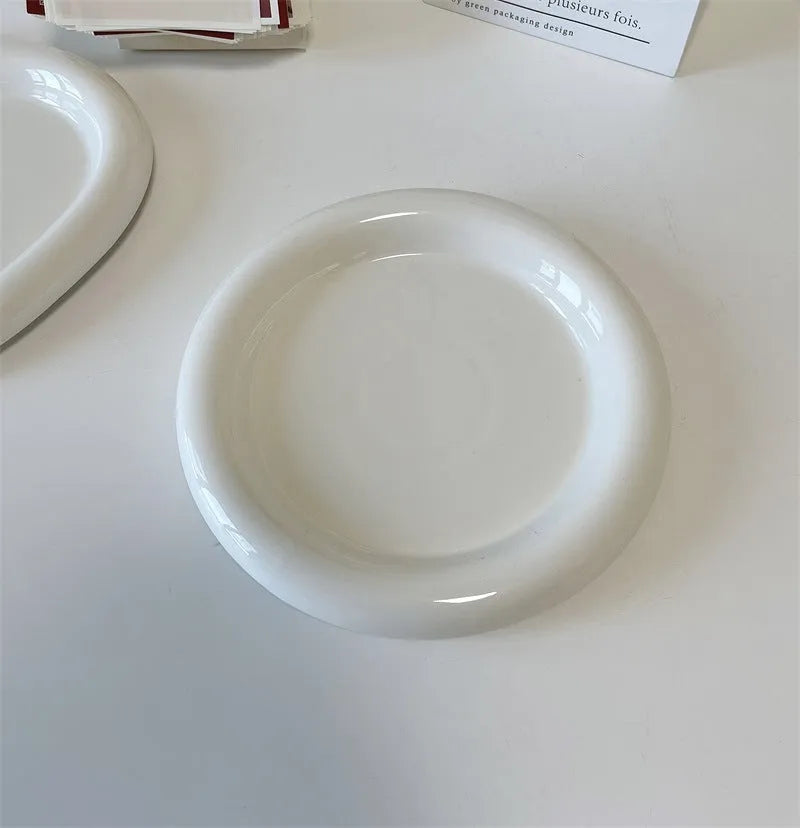 White ceramic plate with doodle design showing bear pattern, suitable for microwave use