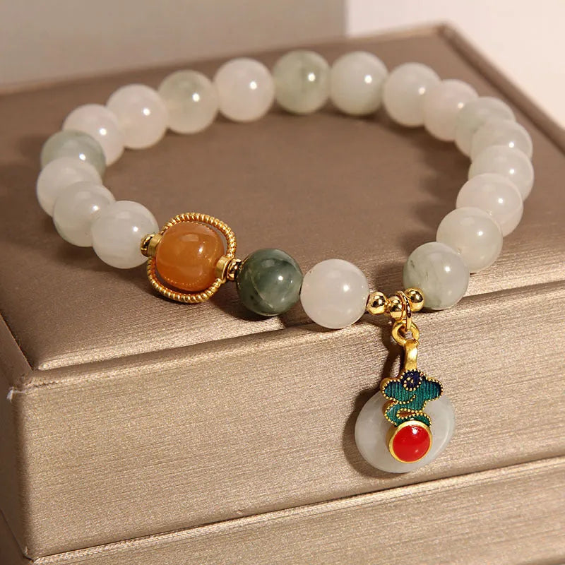 Women's genuine jade bracelet with an ice jade Xiangyun peace buckle and pearl decorative accents.