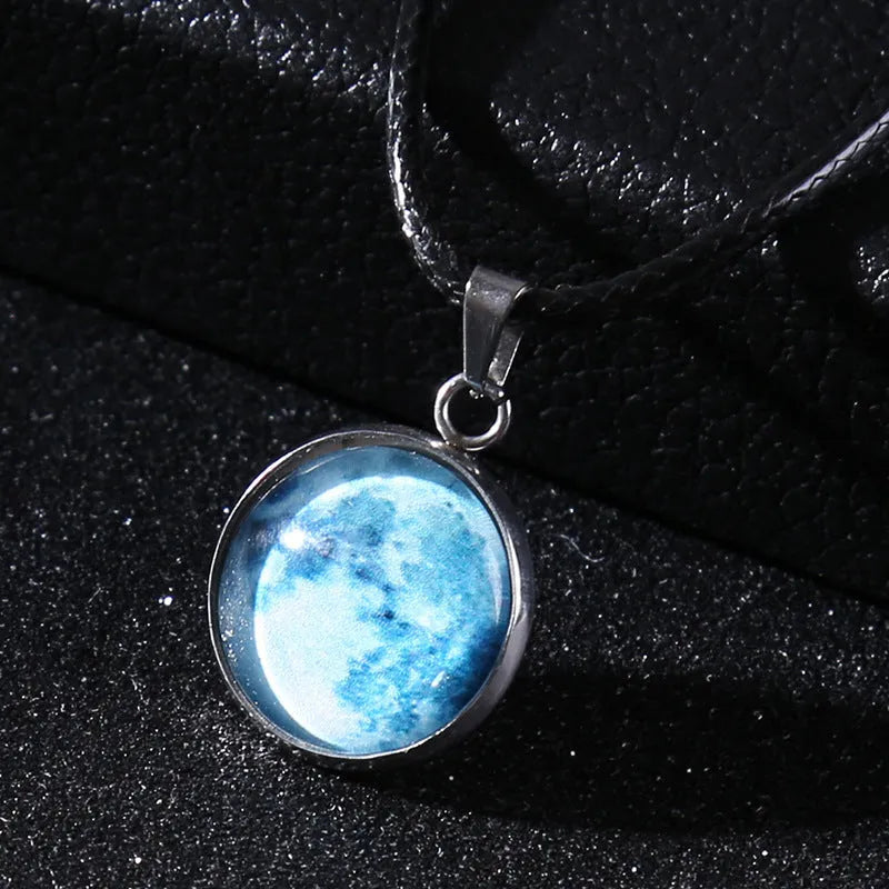 Luminous constellation pendant necklace with adjustable chain on a plain background.