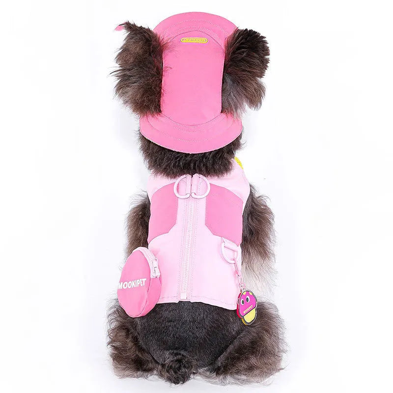 Pink adjustable traction vest on a small dog, showing the fit and fastening.