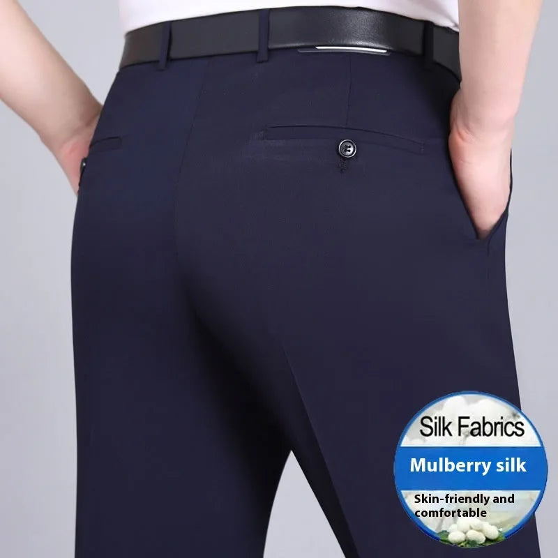 Man wearing dark blue straight-leg suit pants with a high waist, made from a non-ironing mulberry silk blend fabric.
