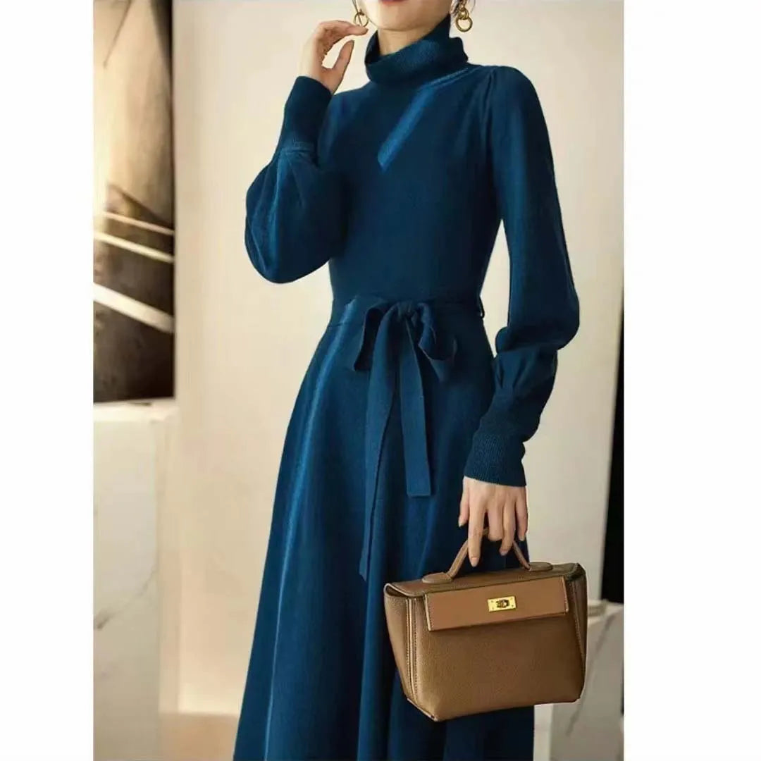 Turtleneck knitwear dress in polyester fabric with elastic waist and loose hem in solid colour