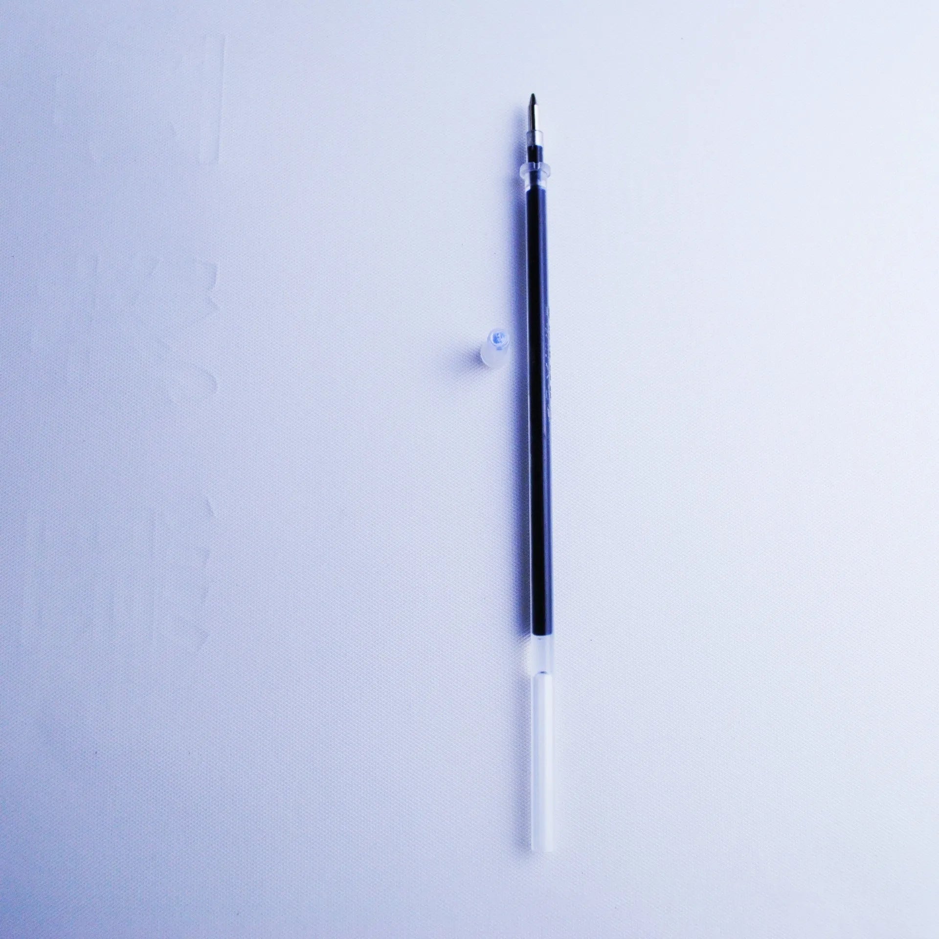 Eight blue pen refills with 0.5mm tips and 130mm body length in plastic packaging