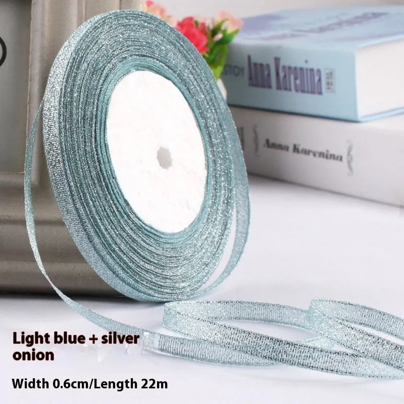 Roll of 0.6cm wide polyester gift ribbon in various colours including gold leaf, coffee and sky blue options