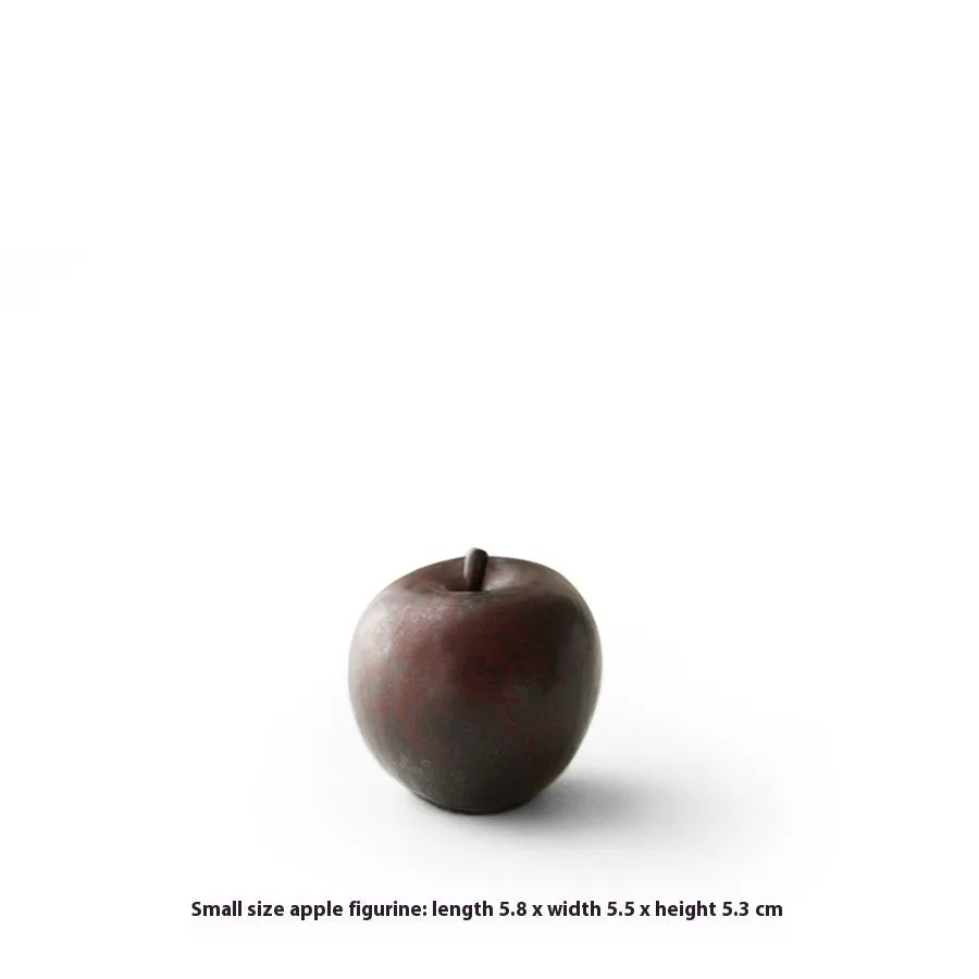 Ceramic apple decoration ornament on a desk, shown in large and small size options.
