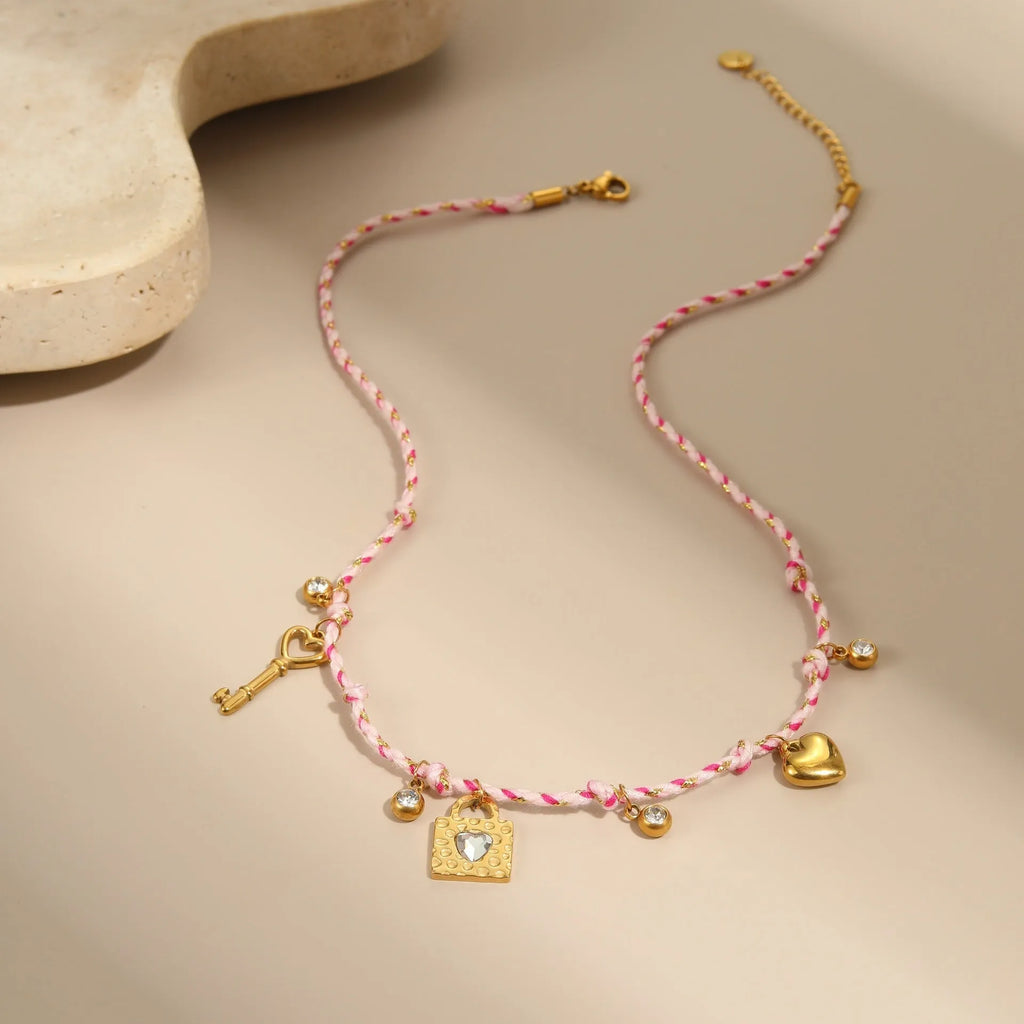 Handmade braided rope titanium steel necklace and bracelet set with 18K gold electroplated heart, star, and geometric pendants.