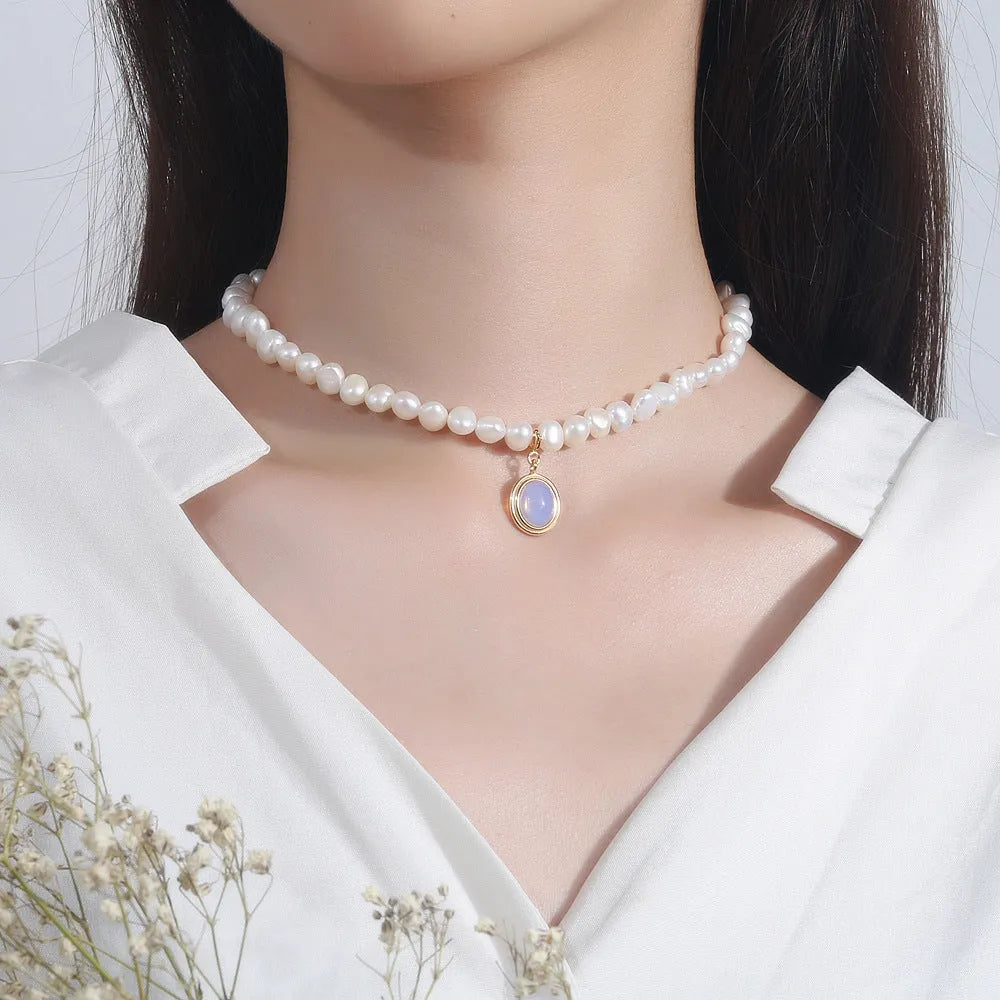 925 silver round medal pearl pendant necklace with irregular pearl geometric design on white background