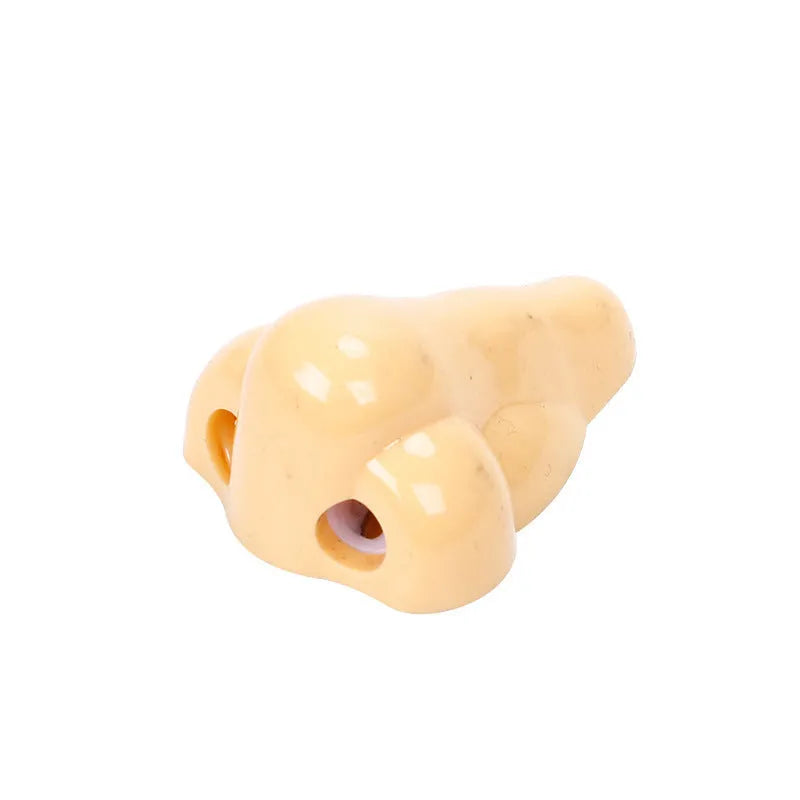 Flesh colour plastic manual pencil sharpener with large shaving container measuring 58x45x30mm
