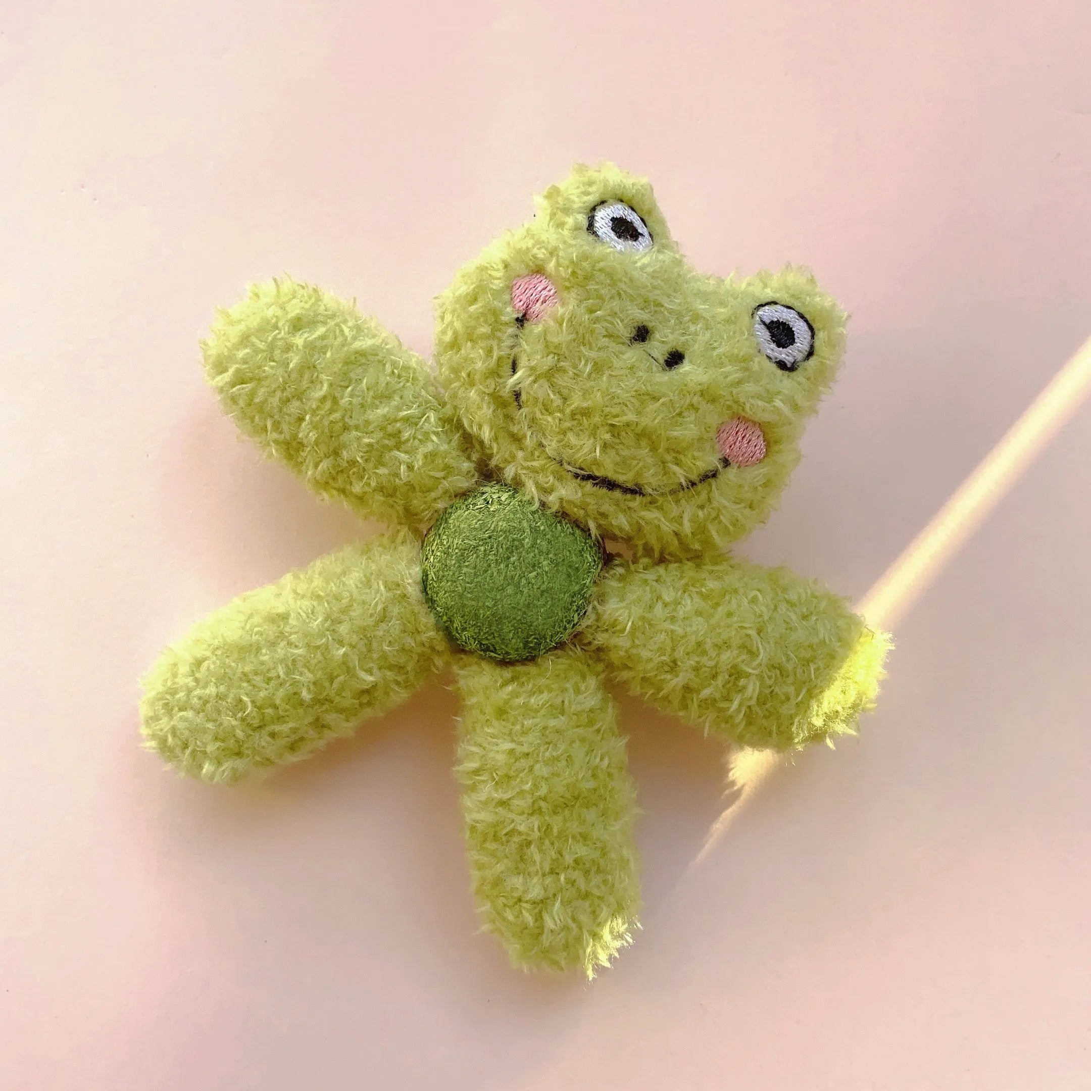 Edible catnip ball chewing toy for cats with plush animal design for dental enrichment