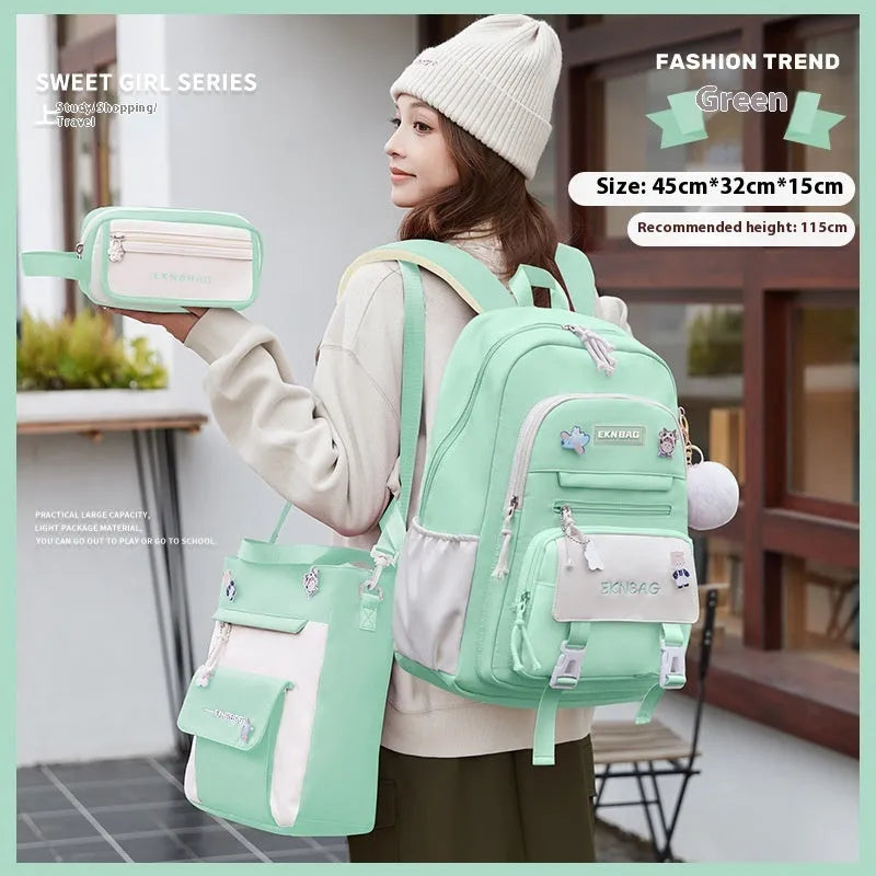 Pink waterproof Oxford cloth school backpack for girls with curved shoulder straps on a white background.