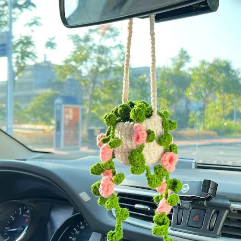 Green and white knitted rope car plant ornament with 8cm base and hanging rope.