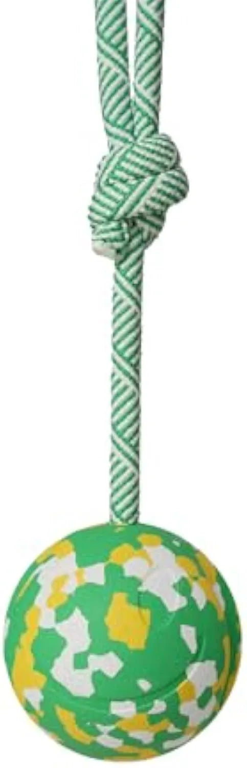 Natural rubber dog ball attached to a nylon rope for fetch and tug of war play.