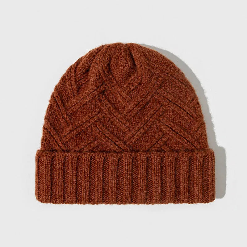 Woman wearing a wool knitted dome crown hat with a totem pattern in ankela red