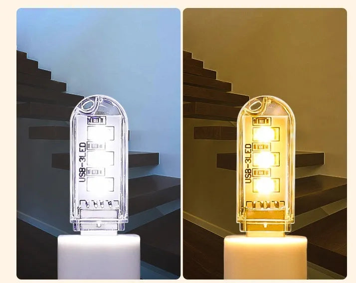 Small white USB-powered baby night light showing warm and white light options on a table
