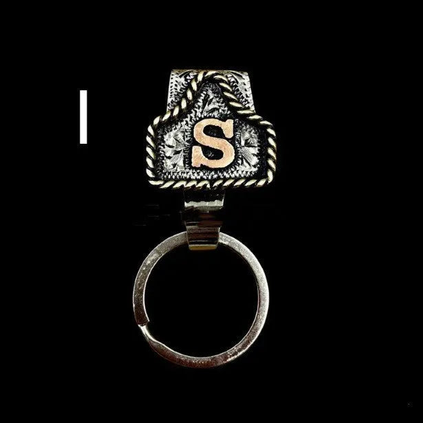 Handmade stainless steel cow tag belt key holder with engraved number plate on a split ring.