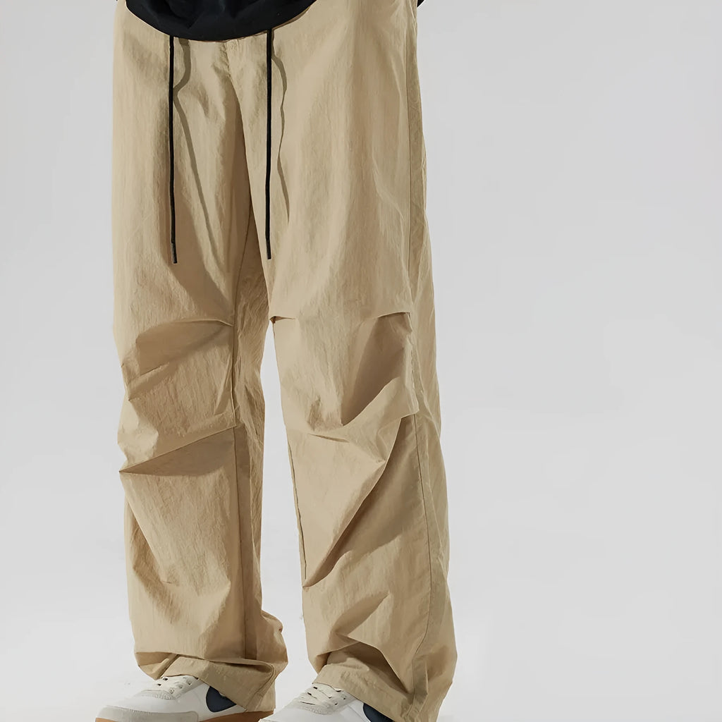 Men's casual trousers in thin ice silk nylon fabric with straight-leg fit, shown in multiple colour options