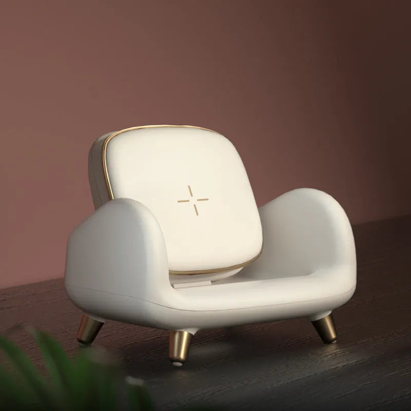 White compact wireless fast charger on a sofa, measuring 98mm by 95mm by 115mm, with USB interface