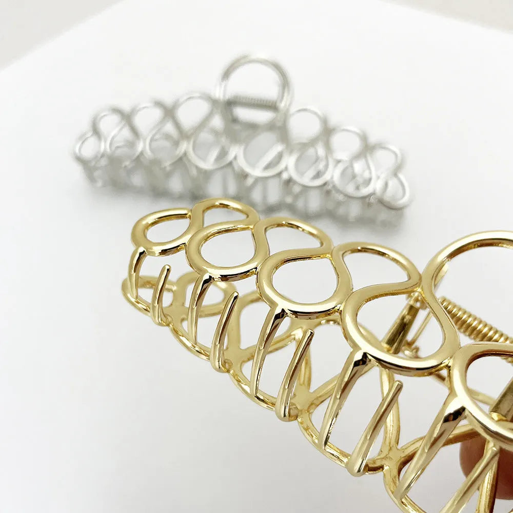 Large minimalist hair clip with tassel detail in gold or silver electroplated alloy