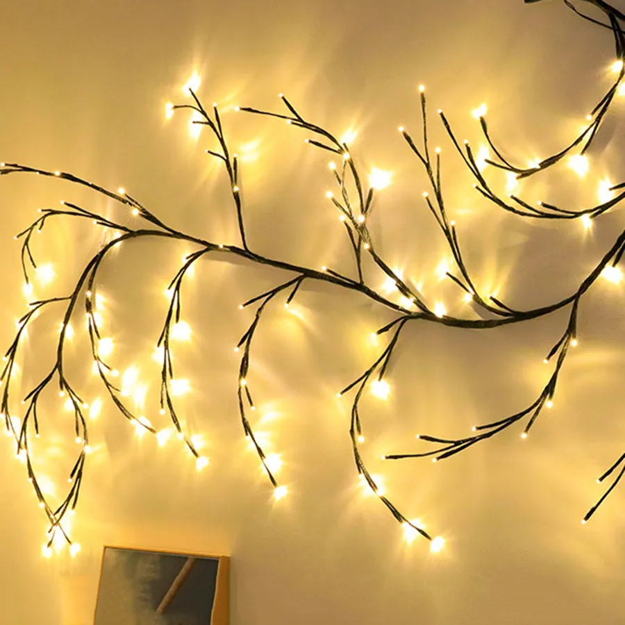 Flexible LED vine light garland with warm white lights on textured birch-bark branches, shaped decoratively.