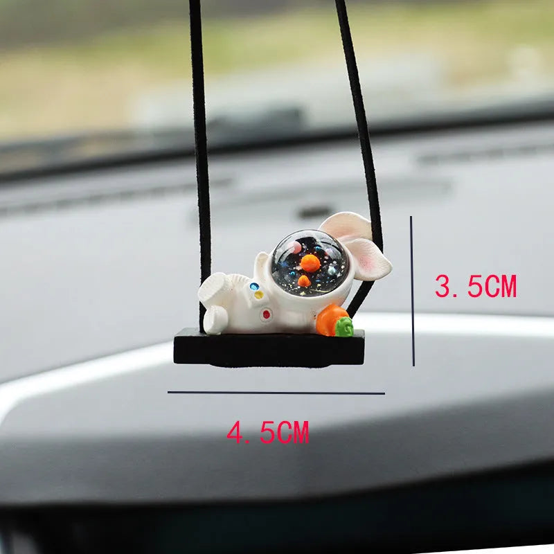 Resin astronaut car pendant in one of five cartoon colour designs