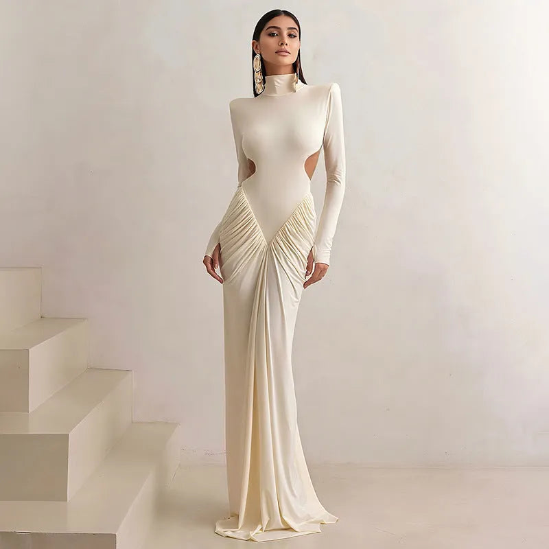 Long sleeve high collar slim fit pleated backless dress in a solid colour on a model.