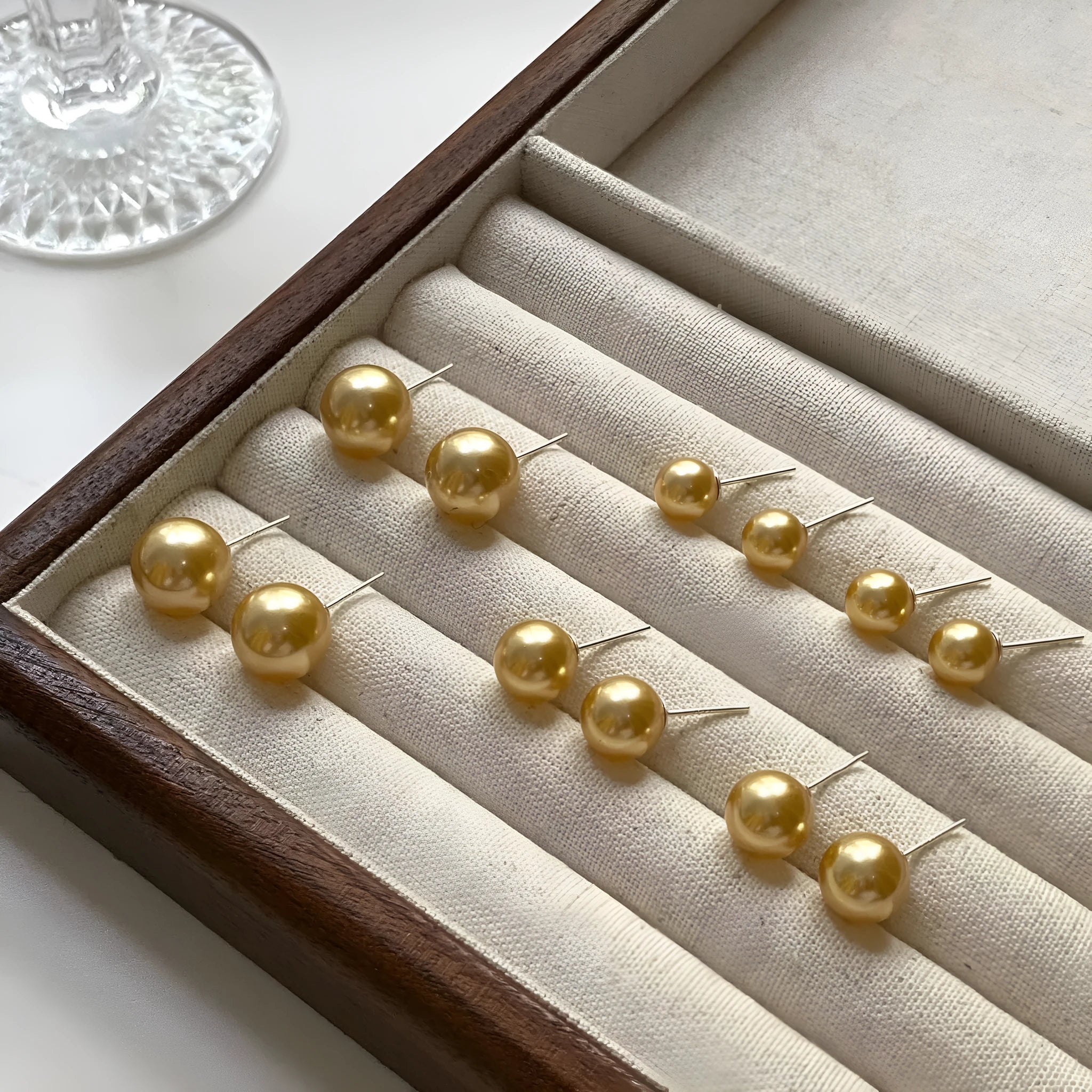 Large geometric pearl stud earrings with retro styling and eight-awm star detailing in silver