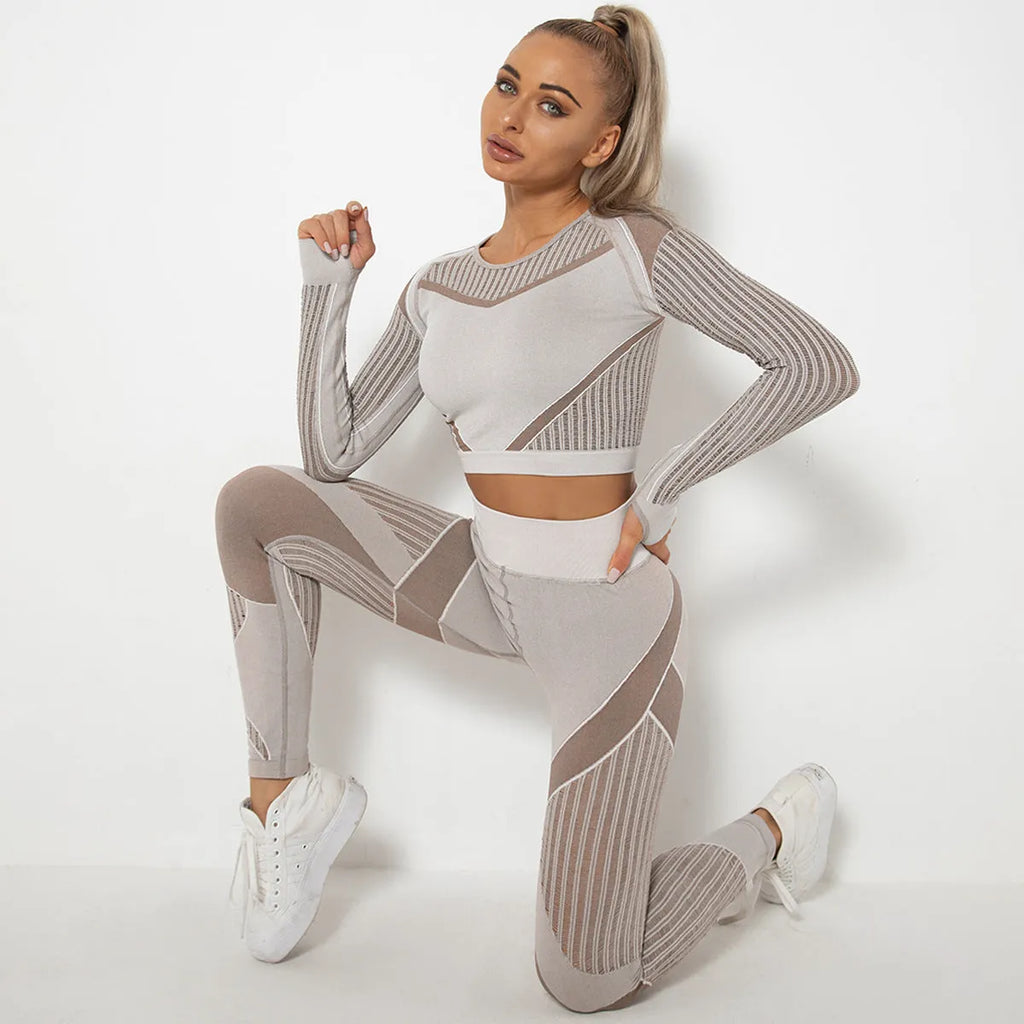 Women's long-sleeved seamless knitted yoga suit in a neutral colour, showing the stretch fabric and close fit.