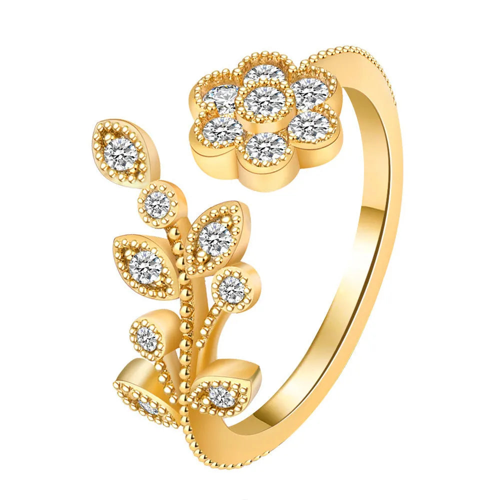Open mouth copper ring with flower and leaf design in a gold finish