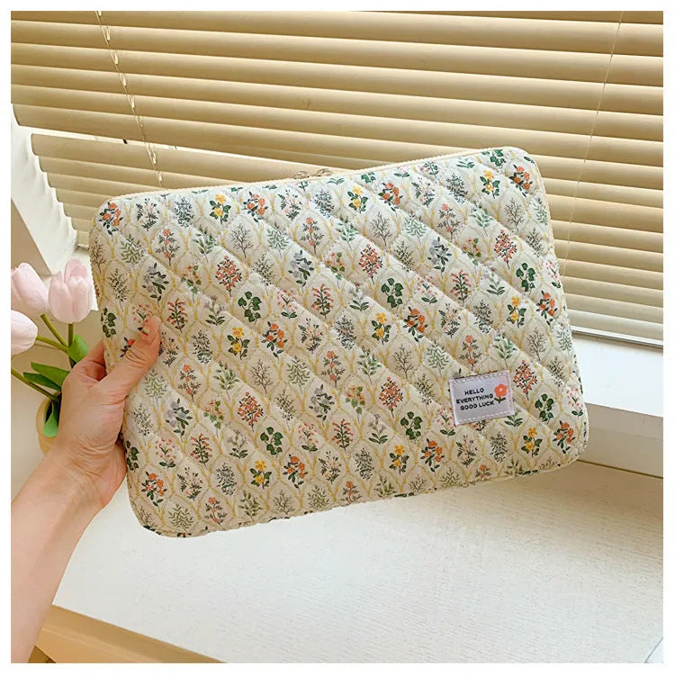 Women's printed cloth laptop bag with floral pattern showing anti-shock protection and storage compartments