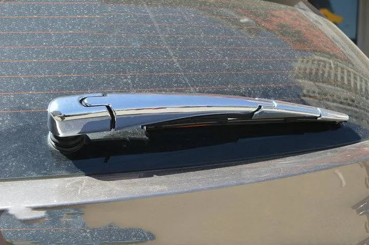 Set of four silvery ABS plastic rear window wiper cover trims for a 2010 Hyundai.