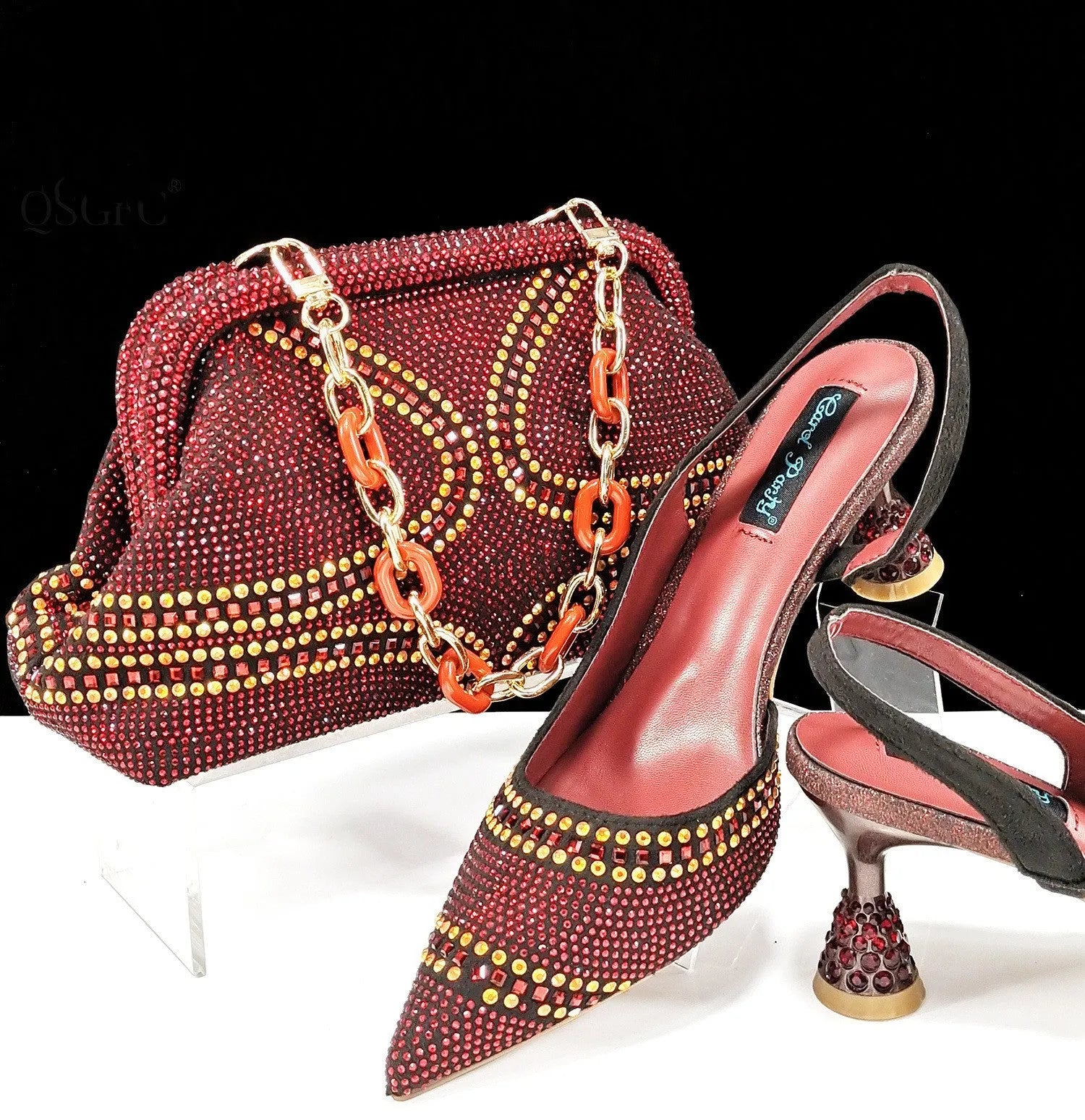 Women's pointed toe high heels with rhinestone details and matching small bag in synthetic leather