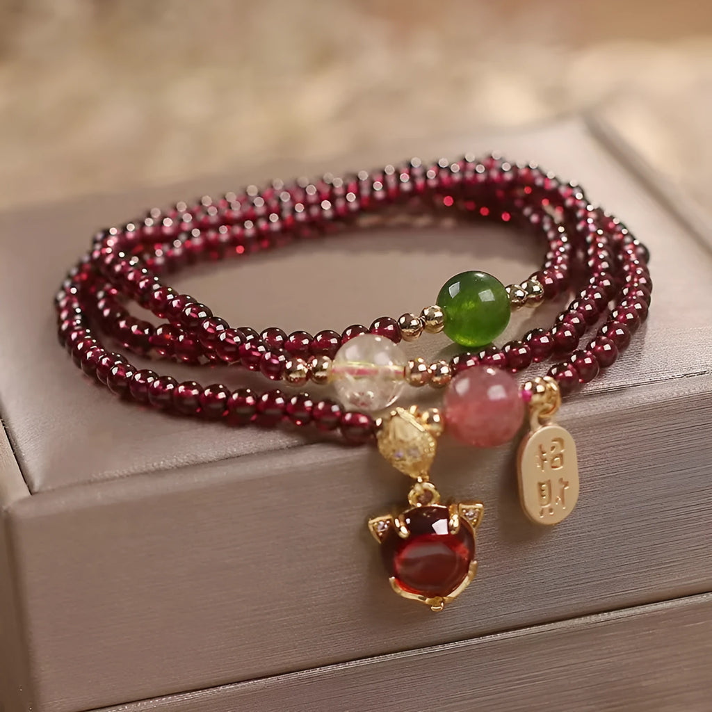 Women's adjustable garnet fox bracelet with rope closure in purplish red colour