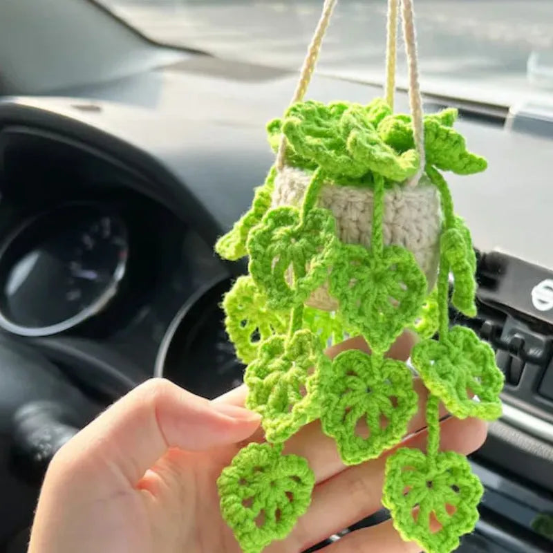 Green and white knitted rope car plant ornament with 8cm base and hanging rope.