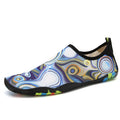 Blue Lycra beach wading shoes with EVA midsole on a sandy beach