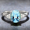 Women's blue zircon court style ring with heart, water drop, and bell pattern designs.