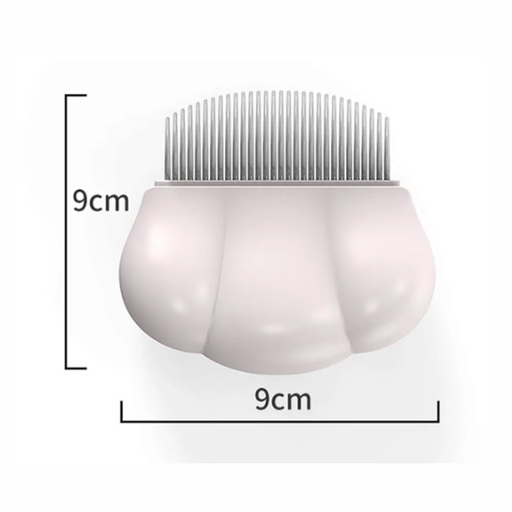 Paw Soft deshedding brush grooming tool for cats and dogs on a white surface.