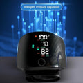 Black wrist blood pressure monitor with USB charging port and digital display.
