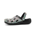Black women's platform sandals with rhinestone details on an open hole design EVA upper.