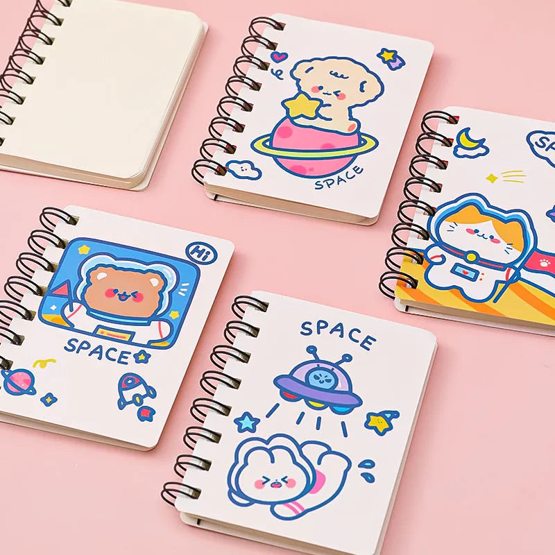 Astronaut flipped portable pocket notebook showing space-themed cover designs at 10.5 by 8 cm size