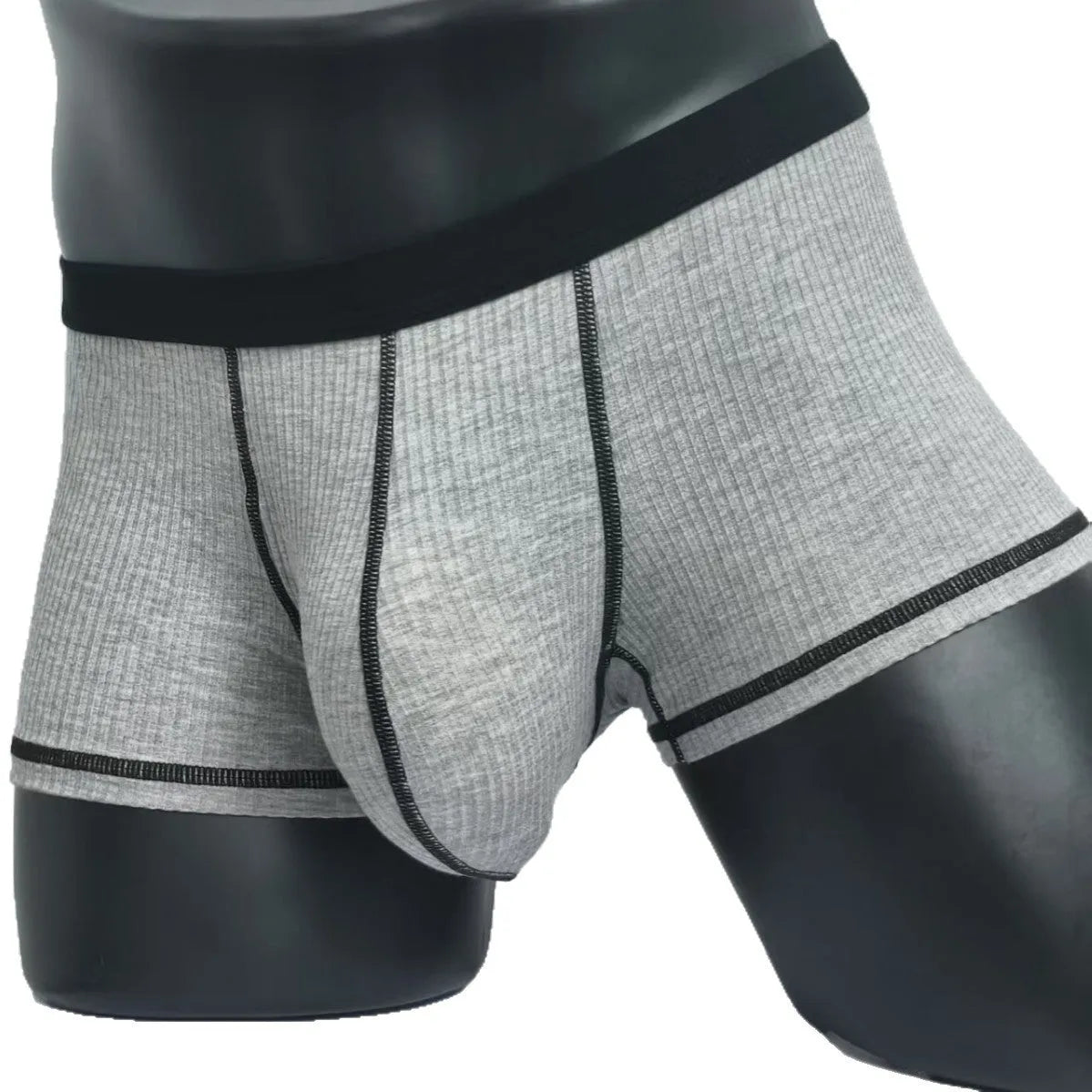 Men's solid colour boxers in breathable fibre fabric on a size chart showing L to 3XL weight ranges.
