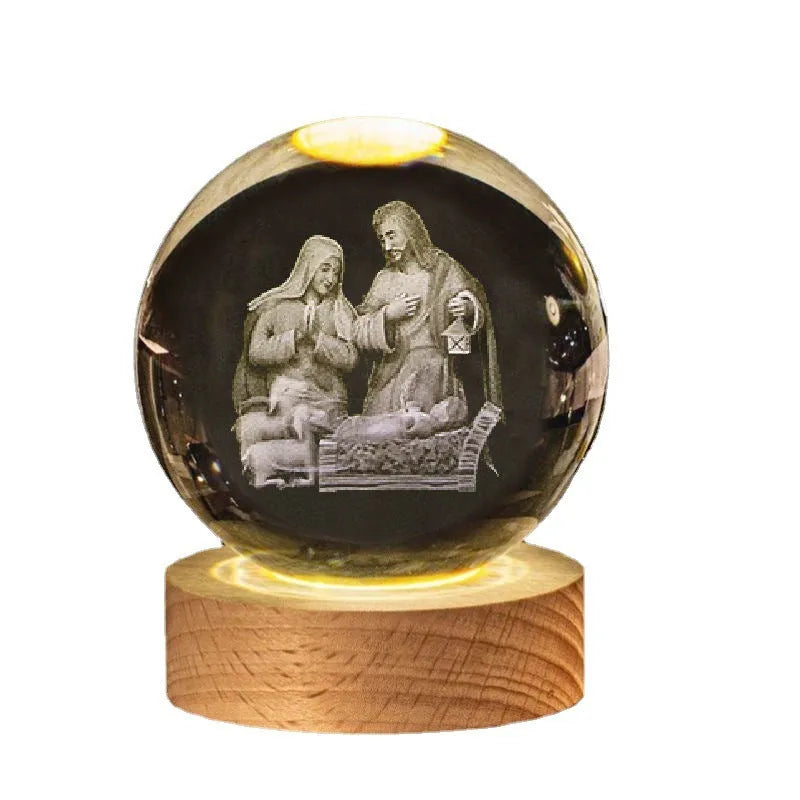 White crystal ball ornament on wood base with warm light and religious symbols