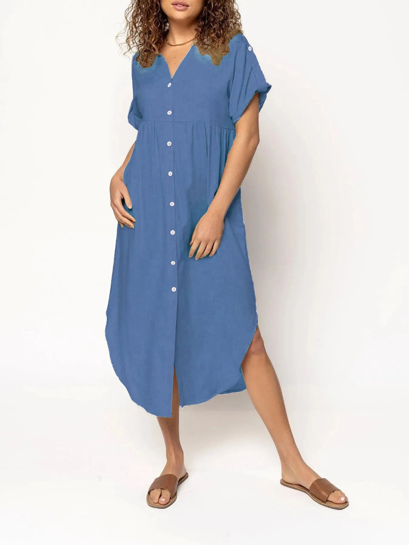A loose-fitting, mid-length casual dress with button detail on the front, shown in a solid colour.