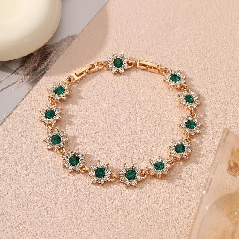 Floral zinc alloy bracelet with electroplated gold or silver finish and gemstone colour variants