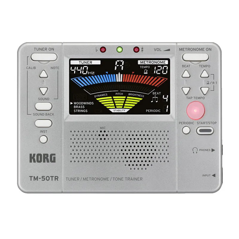 TM-60 black and white universal electronic metronome and tuner on a table.