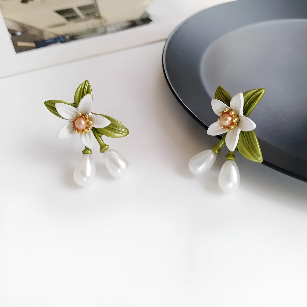 Women's alloy flower earrings with sterling silver needle camellia design and contrast colour styling