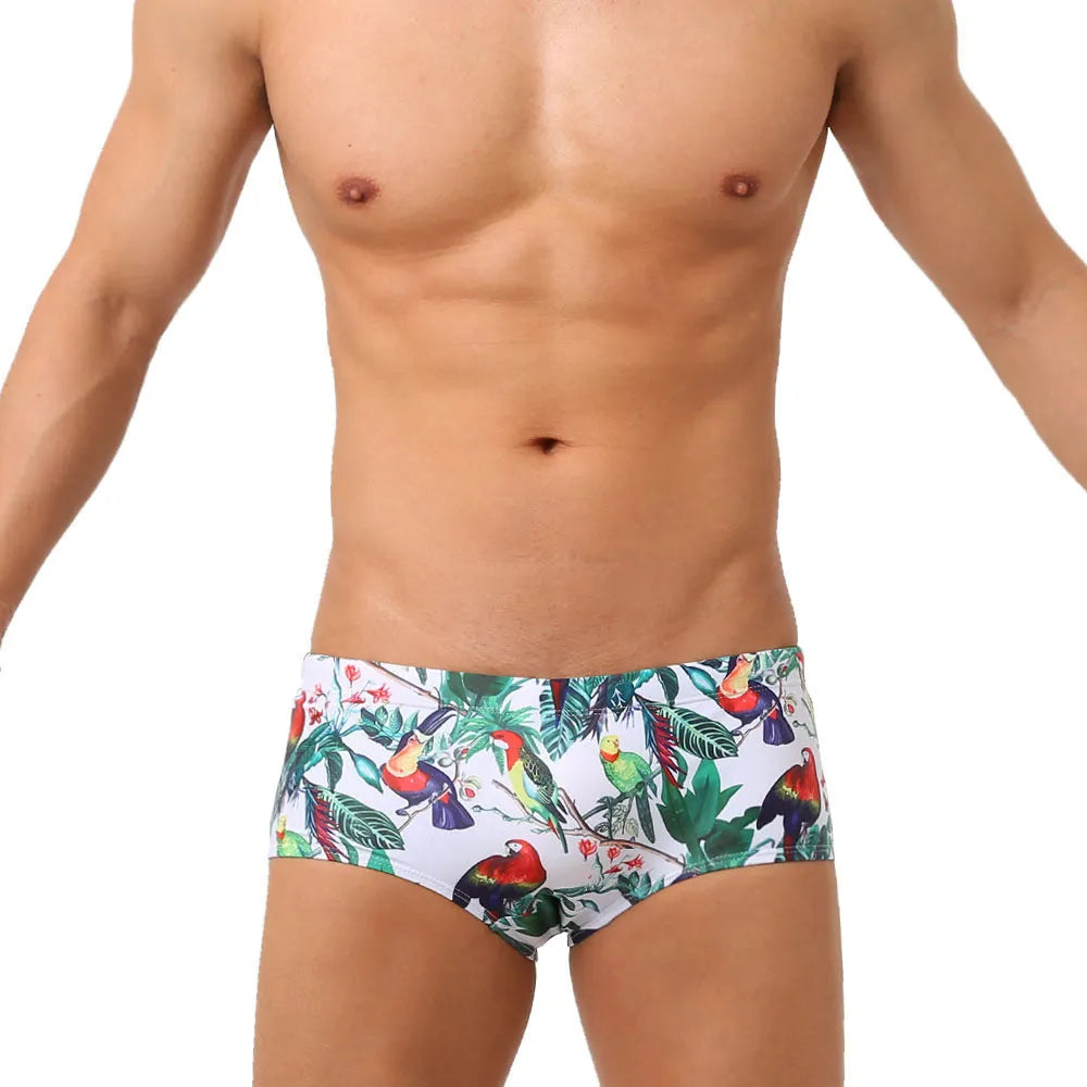 Men's navy swim trunks with white and red flower-bird print pattern, boxer briefs style